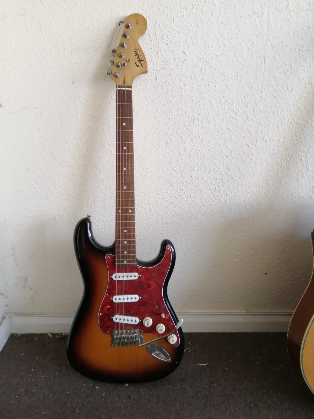 A Squier Affinity Series electric guitar